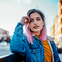 Woman outdoors with pink highlights in her hair
